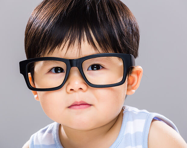 Little kid wearing glasses