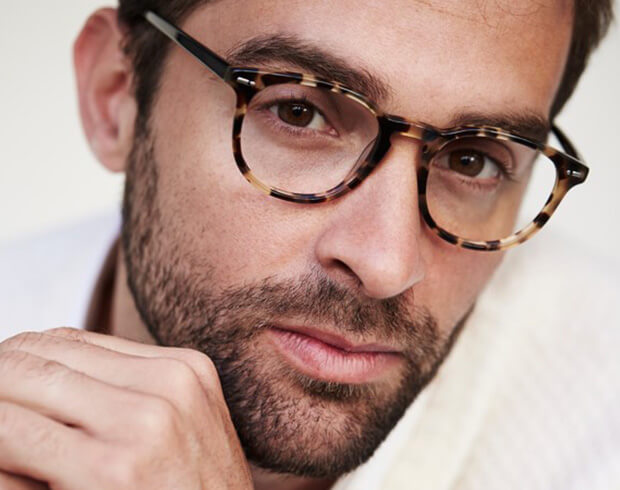 Man wearing branded frames from Look! Optometry