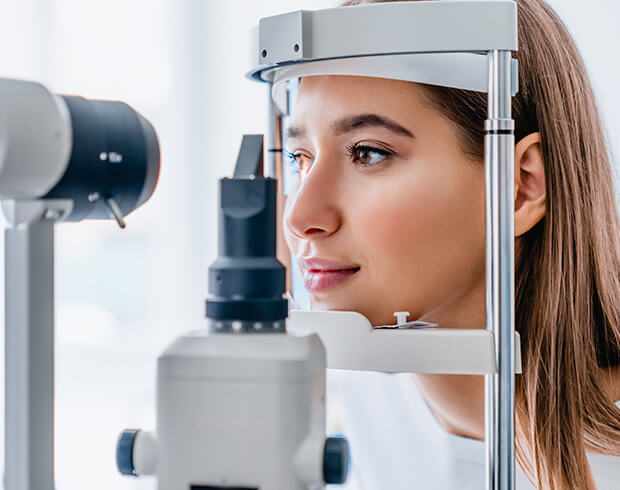 Woman undergoing comprehensive eye exam at Look! Optometry