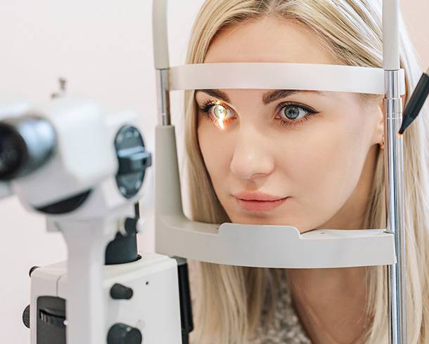 Woman getting an eye exam at Look! Optometry