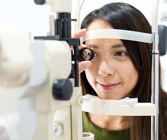 Woman undergoing eye exam