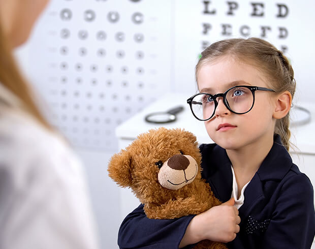 Little girl getting a pediatric eye exam at Look Optometry in Manhattan Beach, CA