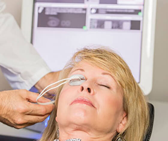 Woman undergoing LipiFlow treatment