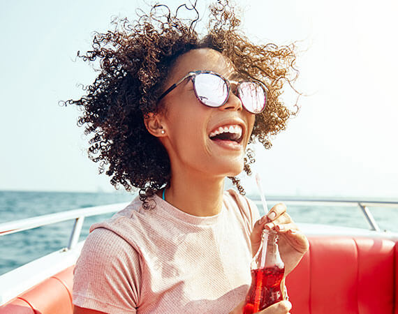 Woman wearing prescription sunglasses from Look! Optometry